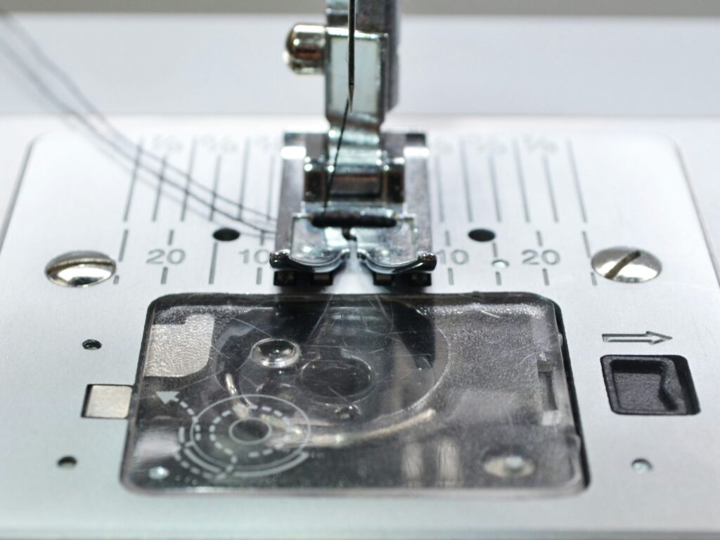 Close up of a sewing machine bobbin case